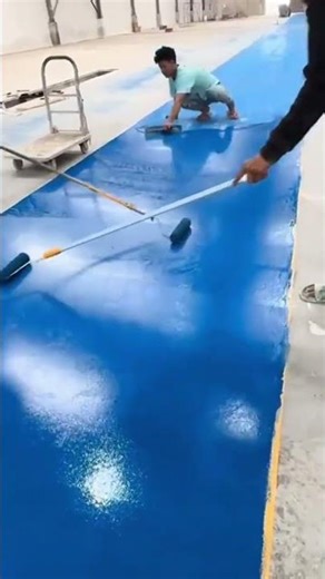Floor Coating Applying Blue Epoxy Resin with Paint Rollers