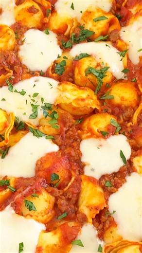 This cheesy baked tortellini is the ultimate weeknight comfort meal. Easy to make in one pan with tender cheese tortellini, savory sausage, marinara sauce, and melty mozzarella! https://www.iheartnaptime.net/baked-tortellini/ | I Heart Naptime
