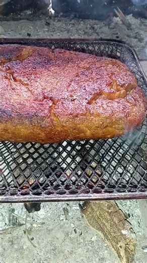 Grilling the other side of the seitan vegan pork roast over the coals. #meatless #smokedmeat