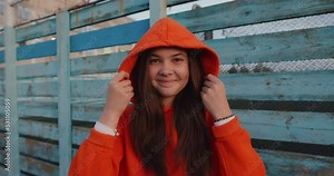 Young girl wearing hood in slow motion