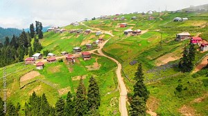 Panorama old beautiful colorful wooden houses in traditional mountains Bakhmaro village - famous summer holiday resort in Georgia