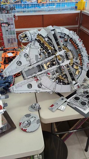 Custom LEGO Millennium Falcon with Amazing Full Interior! Created by Zeke W. with 20,000 Pieces // See it on display at Bricks & Minifigs store in Plano, Texas #lego #legotiktok #legotiktoker #starwars