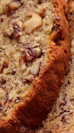 This Banana Bread is unbelievably moist, packed with ripe bananas, juicy raisins, and crunchy toasted walnuts in every bite! 🍌✨RECIPE: https://natashaskitchen.com/banana-bread-recipe-video/ | NatashasKitchen.com