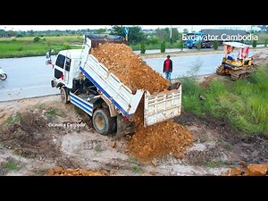 Starting Project Filling Back By Many Dump Truck Unloading Soil- Small Dozer Pushing By Skill Driver