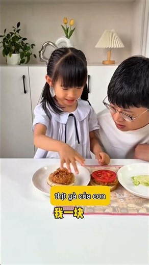Little girl shares a hamburger with her dad, but he only gets the veggies 🤣
