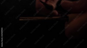 Making fire with a magnesium fire starter. Survival tool setting up a campfire. Slow-motion 180fps. Sparks. High quality FullHD footage