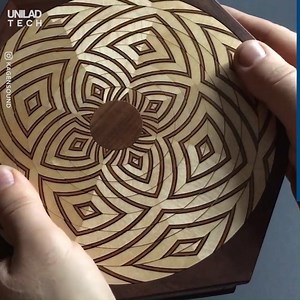 2.1M views · 9K reactions | Over 1,000 pieces of inlaid wood make 8 pattern rings and a different design unlocks each drawer of the Lotus Box  | UNILAD Tech | Facebook