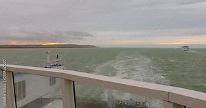 View from the stern of a ferry boat crossing the waters of the English Channel.