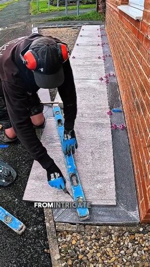 Installing porcelain tiles using advanced leveling techniques.#construction #paving #shorts #fyp