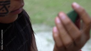 Native Brazilian Woman (India) Painting on her Face in a Indigenous Tribe