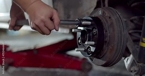 Install the nut onto the adapter wheel and tighten with a wrench.Tightens the wheel nuts with a wrench.