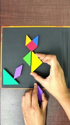 From shapes to a sitting cat 🐱✨ Watch this tangram magic!