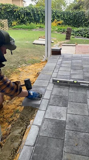 Always use a primer on the substrate & on the back of every paver for a better bond #paving #hardscaper #substrate #primer #bond #construction #dfmpaving