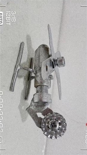 DIY metal helicopter made from bolts and scrap