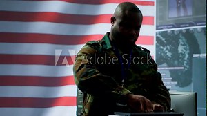 US military personnel work in a modern army command post, safeguarding classified information and state secrets against cyber attacks. Digital warfare and cybersecurity operations. Camera A.