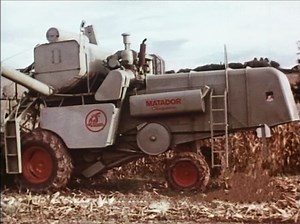 CLAAS MATADOR combine harvester was produced between 1962 - 1970. Speaker text: Since the corncobs pass the threshing tools together with the straw, threshing is very gentle. The corn straw is swathed. It is more practical to equip the harvester with a straw chopper, which chops the straw short and distributes it evenly over the stubbles. Then the field is immediately ready for ploughing. Thanks to special maize threshing equipment, the combine harvester turns into a high-performance maize harve