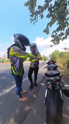 Adventurous Women Motorcyclists in Colorful Racing Gear