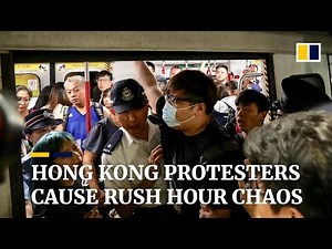 Extradition bill protesters cause rush hour chaos in Hong Kong by blocking main MTR rail line