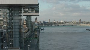 Futuristic design buildings along a river - Free Stock Video