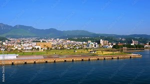 Beppu, Japan. A sunny day in a resort town of Beppu, Japan, with a view of mountains embracing the city and modern architecture