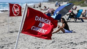 Is it safe to swim in Florida today? What the flags mean and why so many people drowned