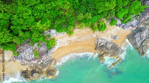 Aerial Top views over beaches, ocean waves crashing on rocks and sand. beautiful tropical sea. Khanom Sichon beaches. Nakhon Si Thammarat, Thailand. 4K drones