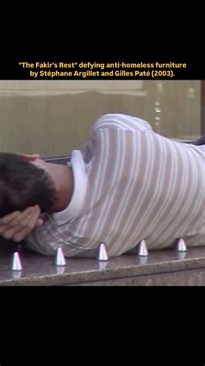Memoir World on Instagram: "“The Fakir’s Rest” was created in 2003 by artists Stéphane Argillet and Gilles Paté as a direct response to anti-homeless architecture. It’s a modular wooden structure covered with blunt nails—playing on the classic fakir bed of nails—but designed to rest on top of unfriendly public benches, the kind meant to prevent lying down. Instead of just criticizing, the piece flips the script. It calls out the way cities try to erase homelessness through design while still off