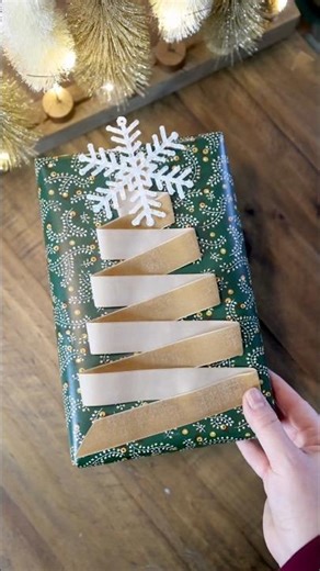 Double sided tape, a simple ribbon fold, and suddenly your presents look designer!#giftwrappingideas