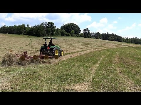 Cutting and Raking Hay on This new Farm!