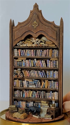 Tamar Cohen Miniatures on Instagram: "I've been creating miniature bookshelves and countless miniature books for quite some time now, and I'm still incredibly excited about each new design I come up with. Check out my Patreon for tutorials. #booklovers #miniaturebooks #minibook #handmadebooks #bookarts"