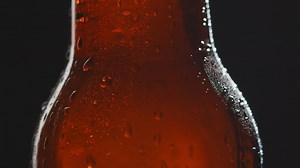 Free stock video - Close up of condensation droplets on bottle of cold beer or soft drink