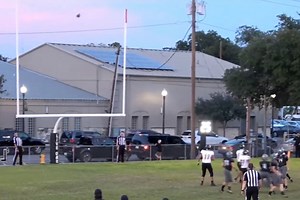 Woman Driving by High School Football Game Makes Incredible Catch Through Car Window