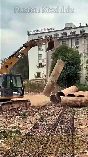 Massive Foundation Work CAT Excavator Handling Giant Steel Casings