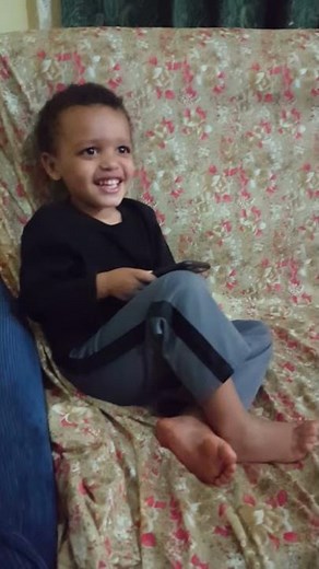 Lukas playing video games and wiggling his toes