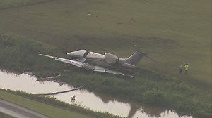 Plane skids into creek at Sugar Land Airport
