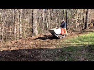 Georgia buggy Dixie Buggy in operation pouring a big concrete retainer. VIDEO#6