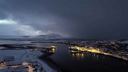 Sunset snow shower over Stromness harbor, Orkney Islands, Scotland, UK
