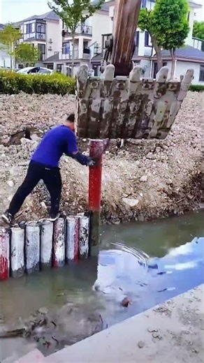 River barrier iron installation for flood control infrastructure