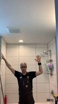 Shower rod installed into ceramic tile.