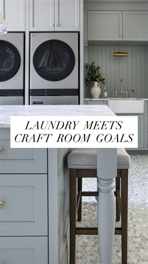 Melissa Manzardo Hryszko on Instagram: "Walk through the arched hallway and custom French doors, and you’ll find one of the hardest-working rooms in the house and maybe the prettiest. This laundry room was designed to do double duty. On one side of the island, we have three built-in pull-out laundry bins to keep sorting off the floor. On the other side? A dedicated spot for our clients' craft supplies, a spot to sit and tackle school projects, or even wrap gifts during the holidays. We stacked d