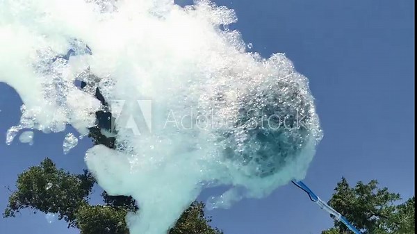 Foam making machine. Organization of a foam party for children and adults in the water park in the pool.