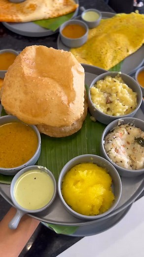 Krupali Patel on Instagram: "Crazy rush for Bangalore style South Indian Food 🤤 Recently visited this cafe in Ahmedabad where you’ll get authentic banglore taste. No use of process cheese and butter.. only amul ghee. Also batter is made with natural fermentation without baking soda. We have tried button ghee podi idli, thatte idli, mysore masala dosa, open butter masala dosa, puri bhaji and filter coffee. Offer: Puri bhaji plate on order above 500/- till 15th December. Jain/Swaminarayan options
