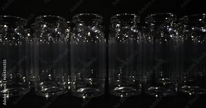 Conveyor belt with empty medical glass vials for injections. Pharmaceutical industry, manufacturing and medicine concept