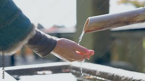 Shrine's innermost grounds is a place to purify the body before entering. Here worshippers wash their hands and mouth, flowing water in an act of ritual purification