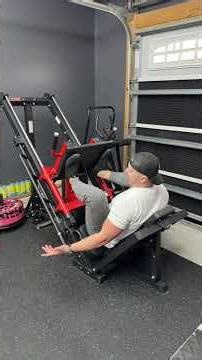 Safety bars catch every rep — machine bottoms out on the stops, so you can push heavy without worry