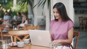 Beautiful Woman Sitting Table Using Laptop Stock Footage Video (100% Royalty-free) 1055367803 | Shutterstock