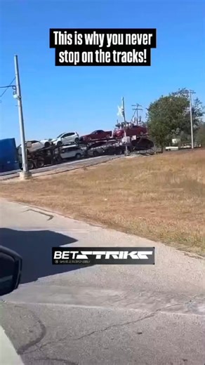 SkidViper on Instagram: "A dramatic and catastrophic accident at a railroad crossing. A large car-hauling semi-truck appears to be stuck or bottomed out on the elevated tracks. As a freight train approaches at a high speed, the driver of the truck is seen running away from the vehicle just moments before the collision. The train slams into the middle of the trailer, completely obliterating the car carrier and sending debris flying everywhere. The sheer force of the locomotive pushes the remains