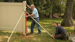 How to Install a Vinyl Privacy Fence: Set Posts and Panels - Fine Homebuilding