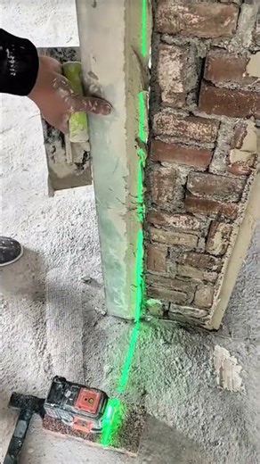Green laser line marking column, crisp rhythm of night construction craft