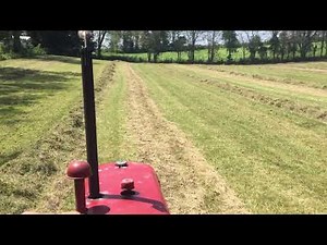 Raking Hay With the Super C and Farmhand M25 Wheel Rake